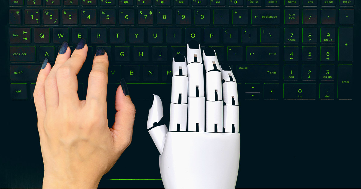 A human hand is joined above a keyboard by a white robot hand, indicating the marriage of AI and humans in creating content together.