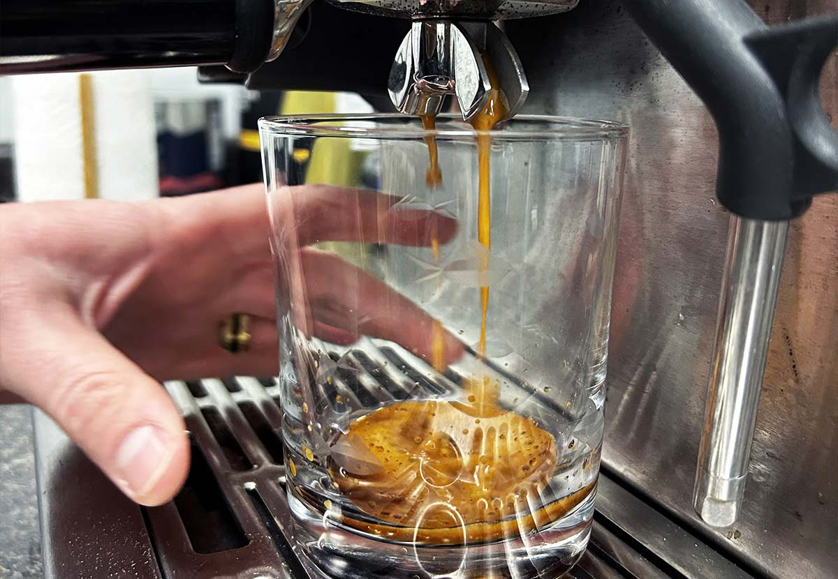 espresso dripping into a glass