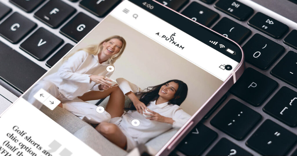 a phone screen showing a product page for a clothing website featuring two women in pajamas